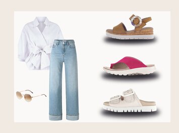 Ein Outfit bestehend aus einer weißen Bluse mit Bindegürtel, einer hellblauen Jeans mit weitem Bein und einer Sonnenbrille. Daneben sind drei Paar Sommerschuhe zu sehen: braune Sandalen mit Schnalle, pinke Pantoletten und weiße Pantoletten mit zwei Riemen. | © aboutyou.de